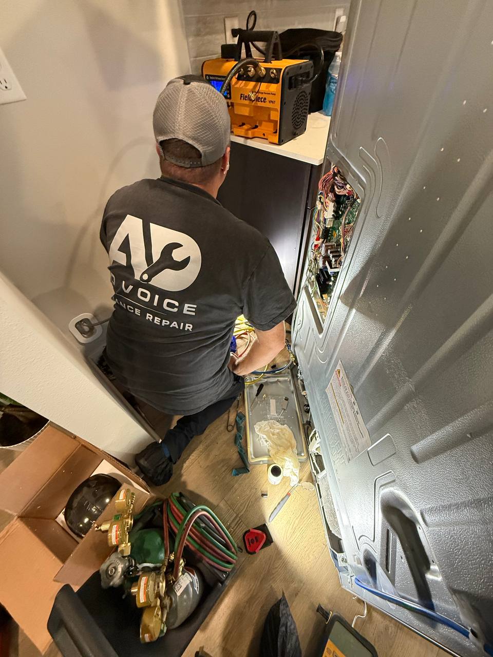 Alex repairing an appliance